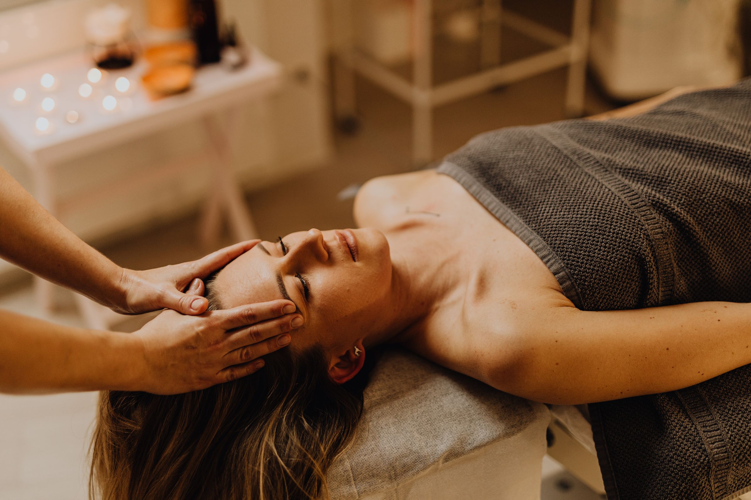 Woman receiving facial treatment