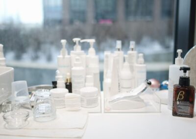 A collection of skincare products on a countertop in a contemporary beauty salon setting.