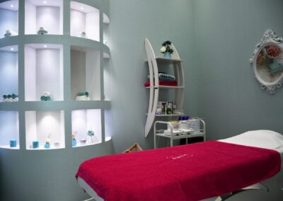 Modern spa room in Abu Dhabi with stylish decor, ambient lighting, and luxurious fittings.